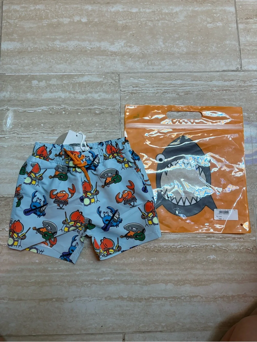 Stella McCartney Kids Light Blue Crab Print Swim Shorts with Orange Drawstring